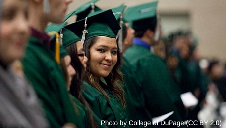 smiling woman in cap and gown